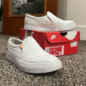 White Nike Court Royale slip on shoes.
